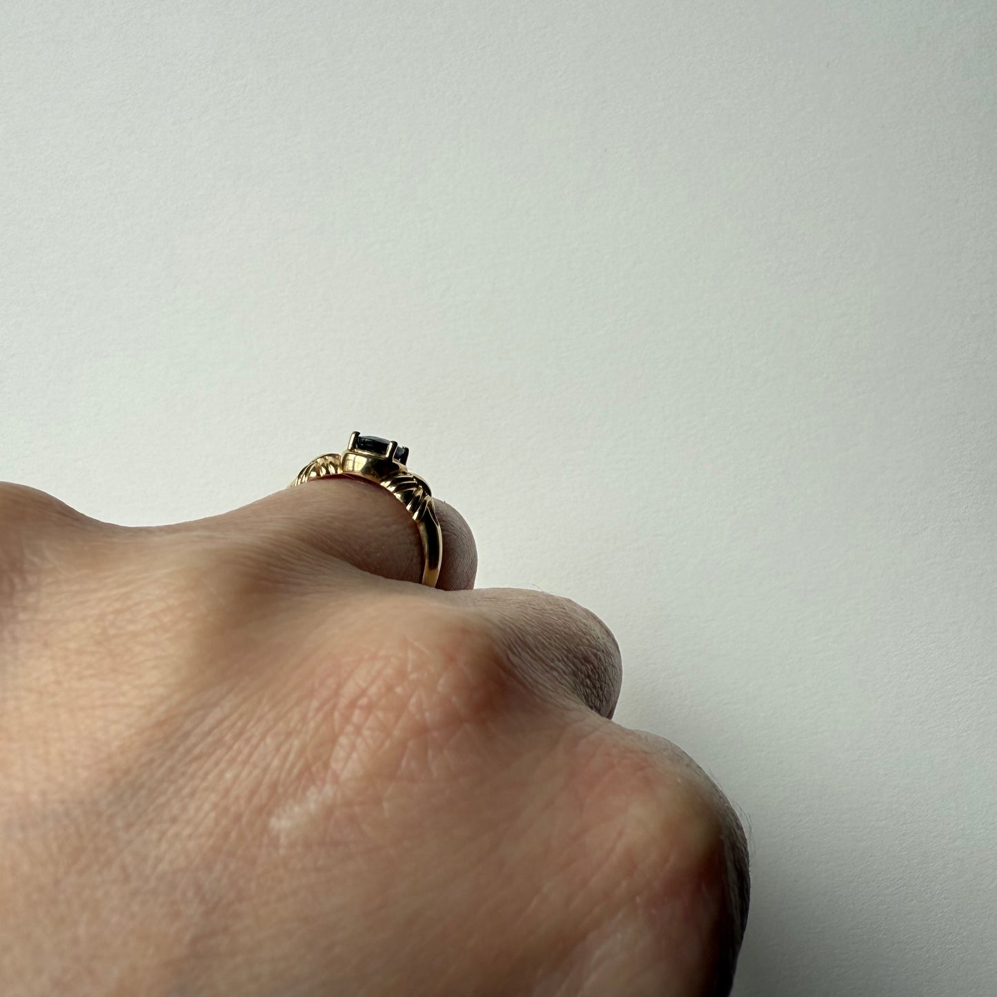 French Art Deco 14k Yellow Gold Sapphire Ring on hand side view