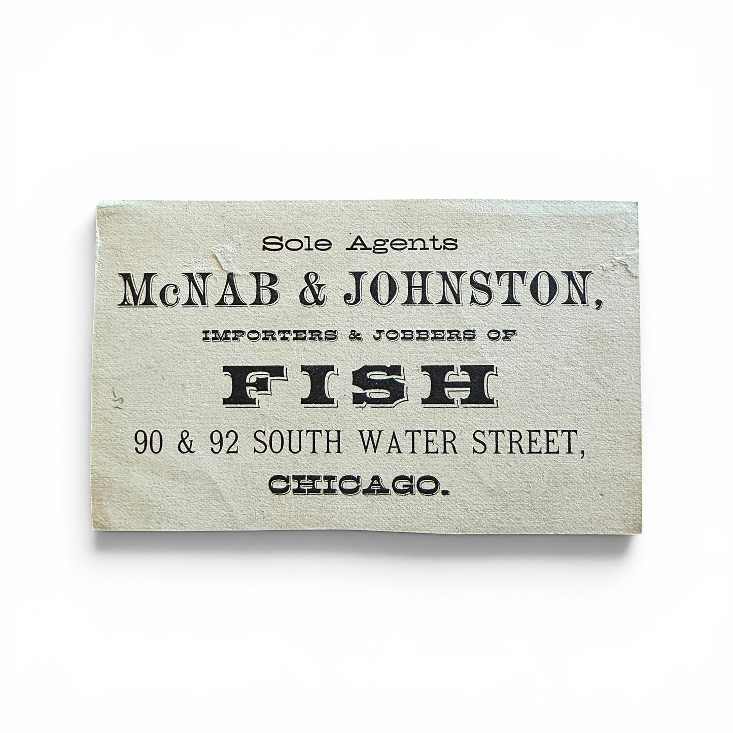 Vintage sign for McNab & Johnston, importers and jobbers of fish in Chicago.