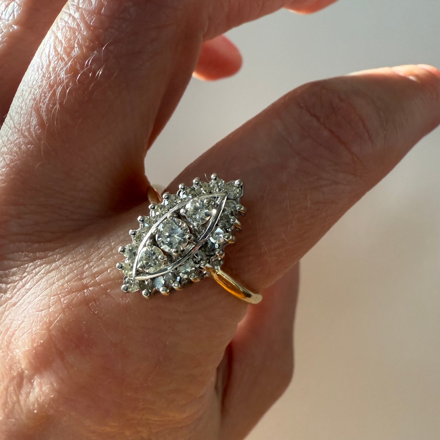close-up 14k Yellow and White Gold Marquise .45ctw Diamond Ring on hand