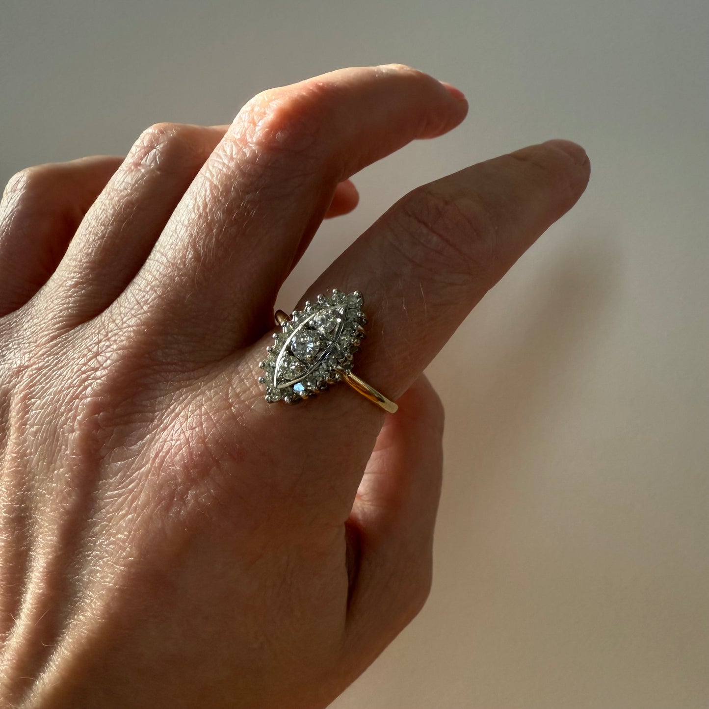 14k Yellow and White Gold Marquise .45ctw Diamond Ring on hand in sunlight
