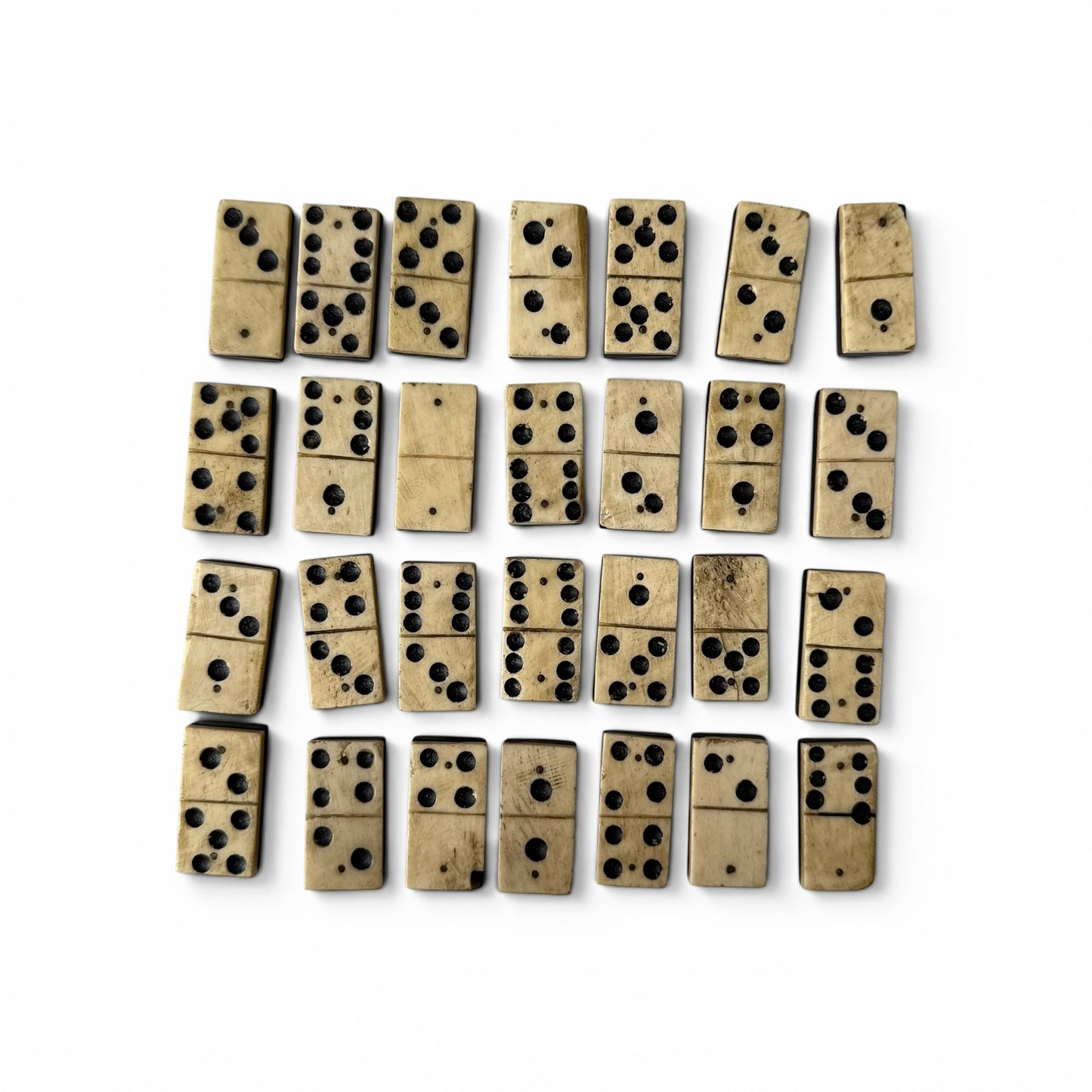 1854 Bone And Ebony Domino Set With Box Art Set of bone dominoes on a white background