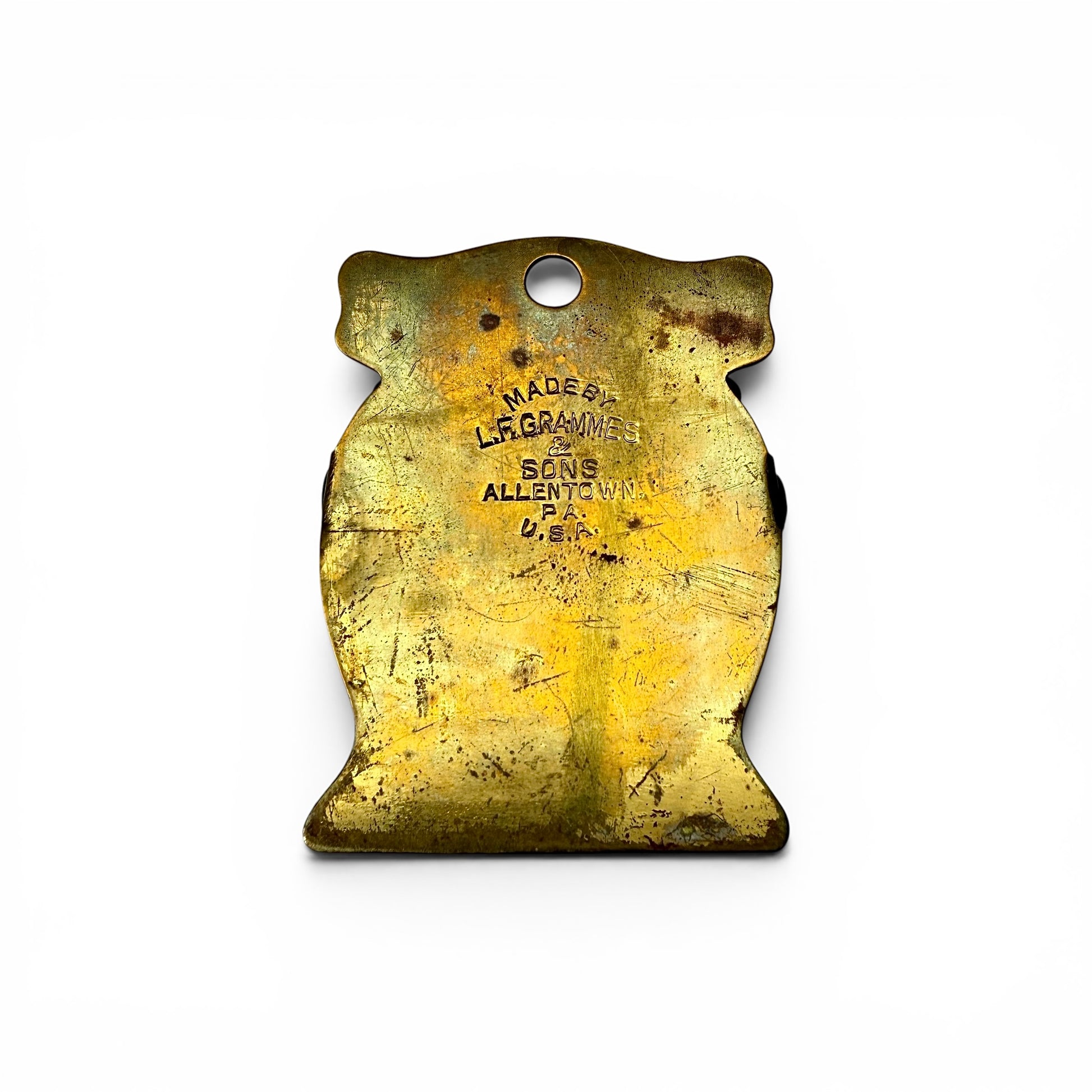 1920s Brass Advertising Paper Clip Vintage metal object with engraved text on a white background