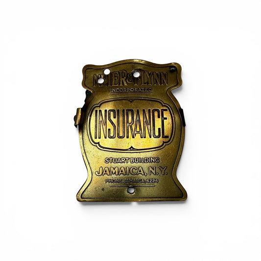 1920s "Insurance" Brass Advertising Paper Clip Vintage brass insurance sign with engraved text on a white background