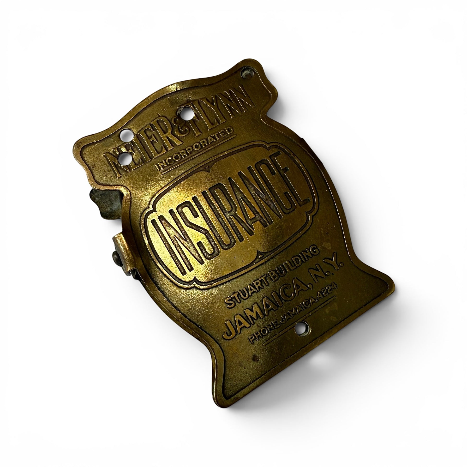 1920s "Insurance" Brass Advertising Paper Clip Bronze insurance badge with 'Neier & Flynn Insurance' text on a white background
