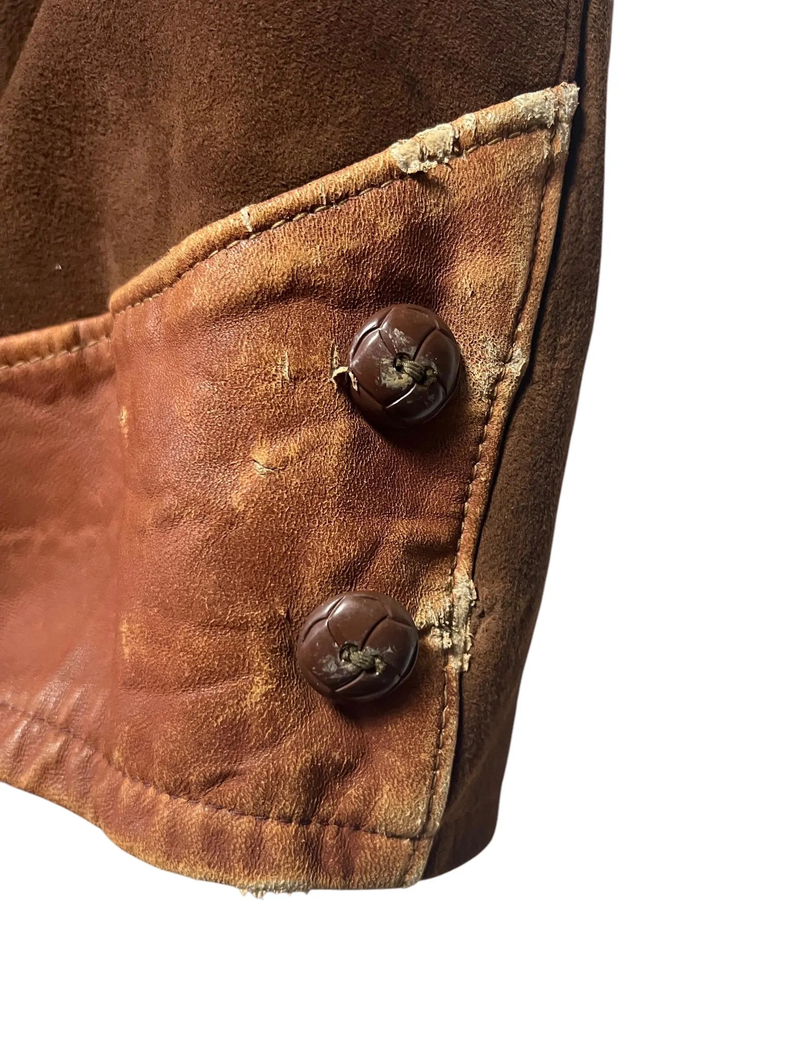 1930/1940s Cross Country Togs 2-Tone Half Belt Back Leather Jacket Close-up of a brown leather jacket with two buttons on a white background