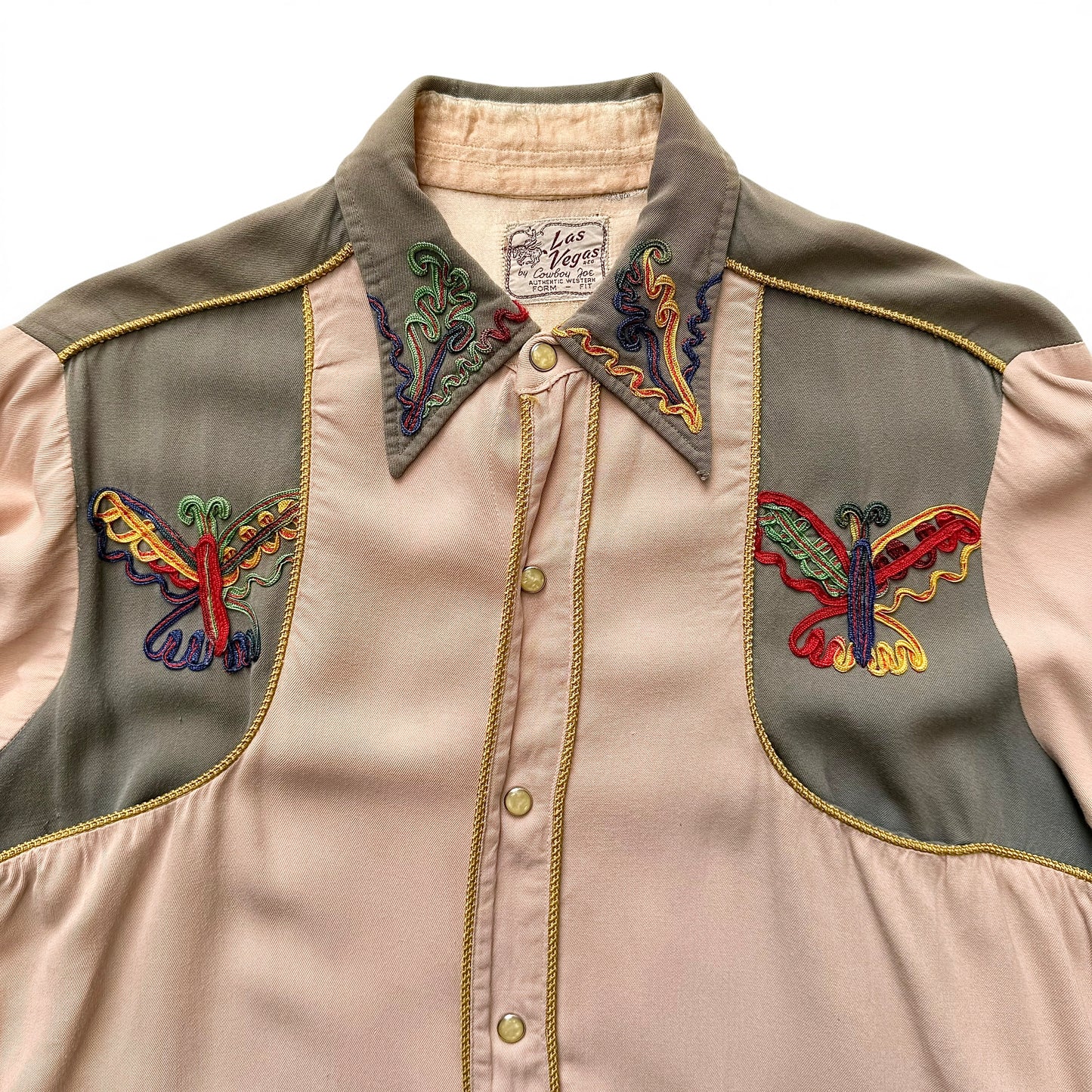 1940/1950s Las Vegas By Cowboy Joe Embroidered Western Shirt Close-up of a vest with embroidered butterfly designs on a beige background