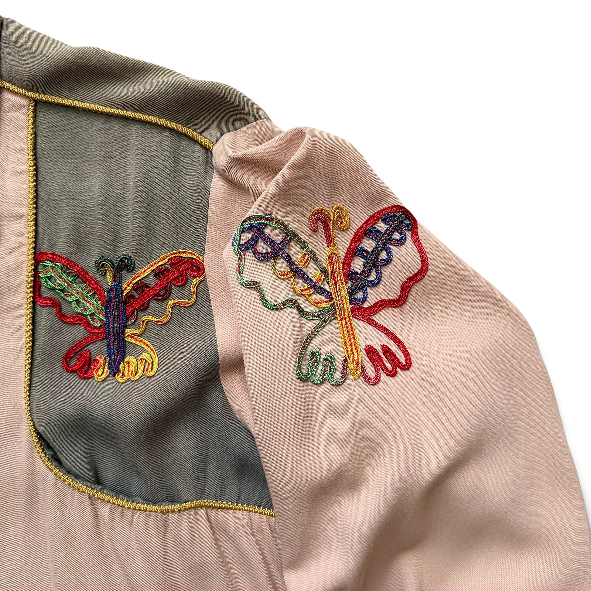 1940/1950s Las Vegas By Cowboy Joe Embroidered Western Shirt Embroidered butterfly designs on a garment with a neutral background