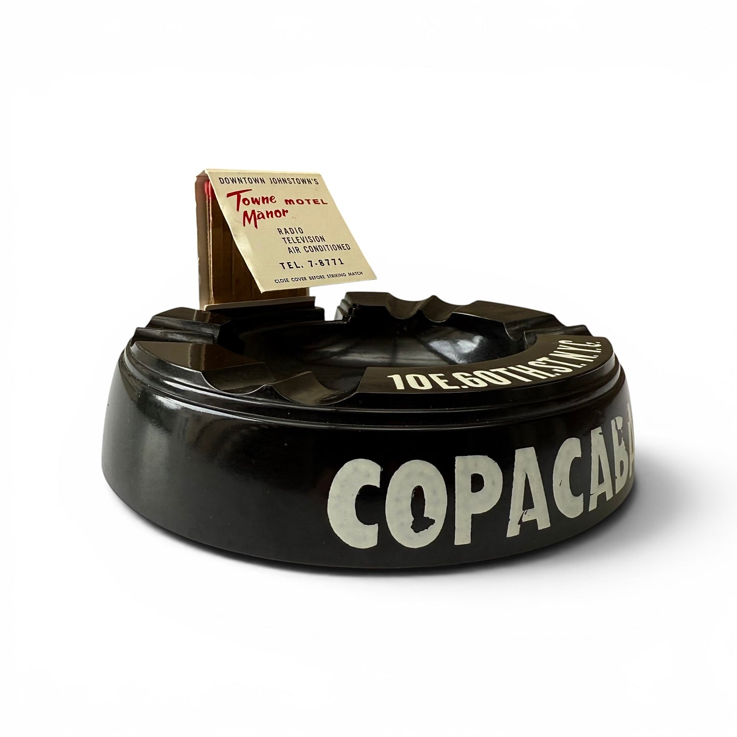 1950s Copacabana Bakelite Ashtray Black ashtray with 'Copacabana' branding on a white background