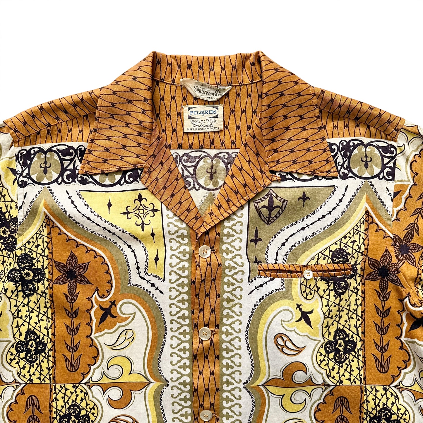 1950s Pilgrim (Sears) Rayon Border Print Sport Shirt Patterned shirt with a visible brand label on a white background