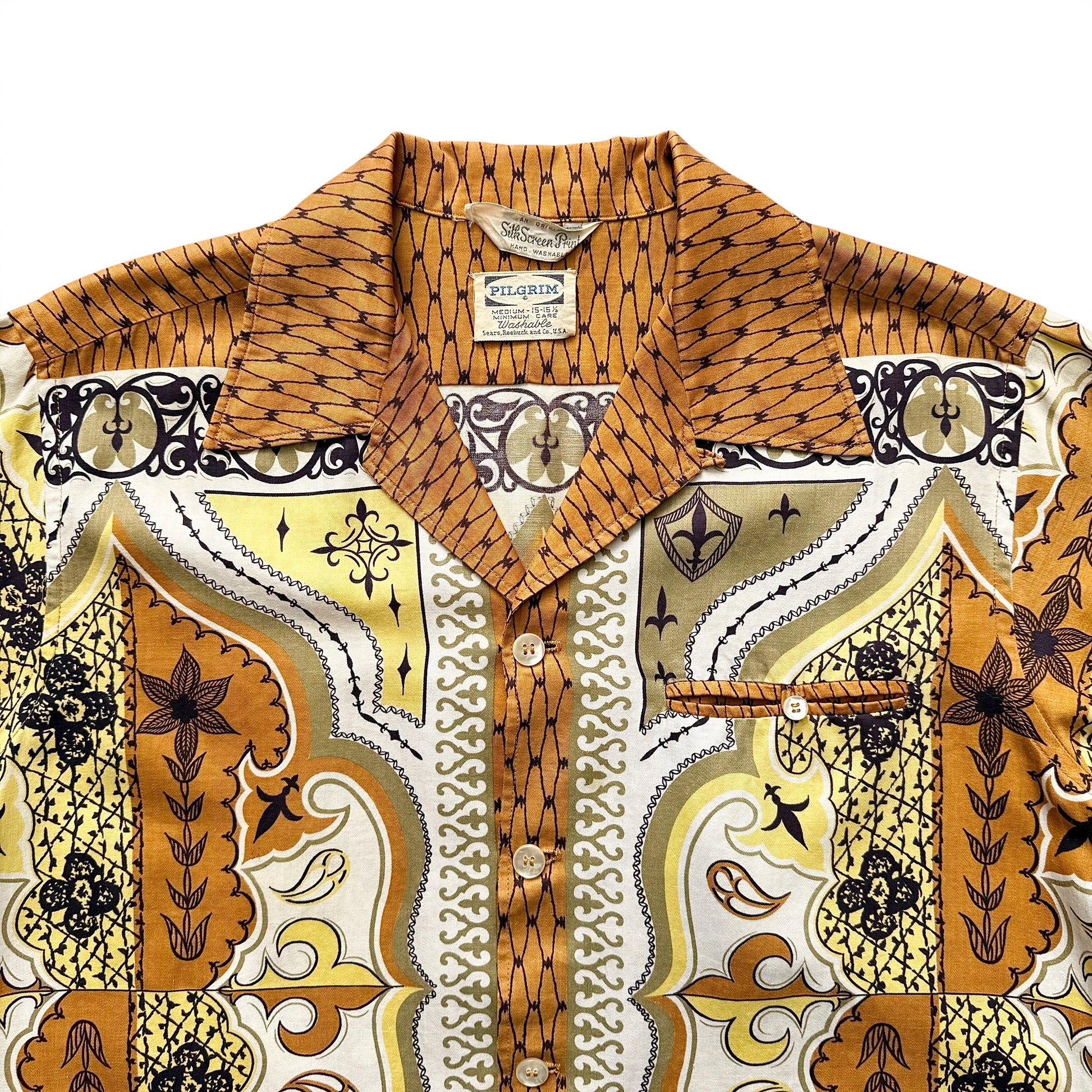 1950s Pilgrim (Sears) Rayon Border Print Sport Shirt Patterned shirt with a visible brand label on a white background