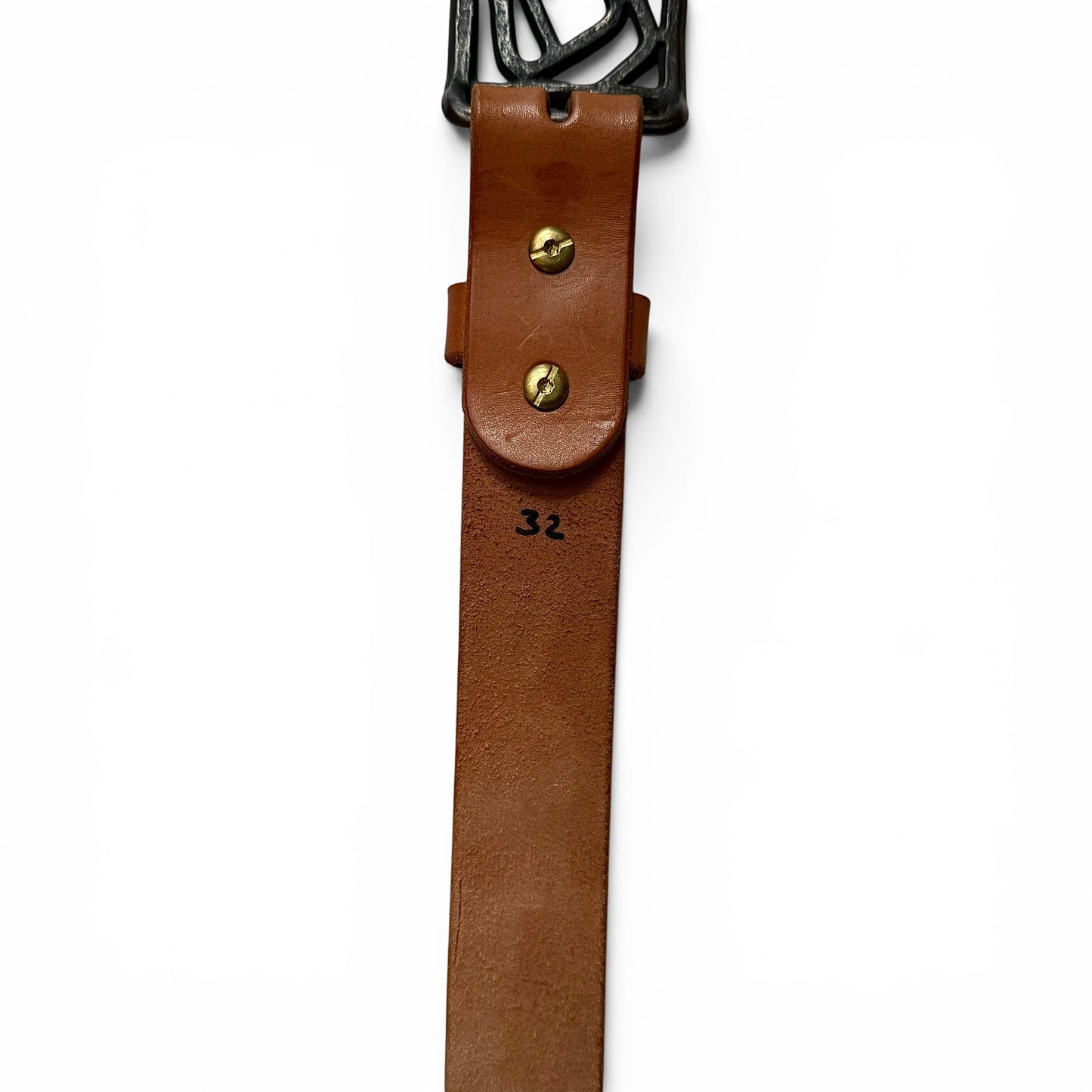 1960s Hammered Brass Abstract Buckle Leather Belt Brown leather belt with a wooden buckle on a white background