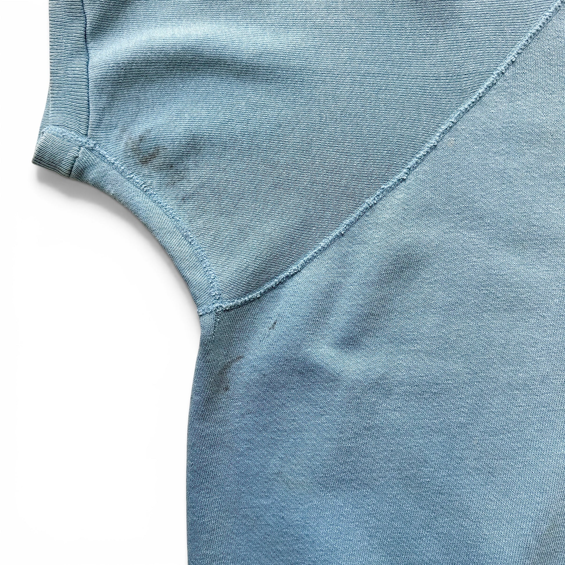 1960s Indian Motorcycles Short Sleeve Sweatshirt Close-up of a light blue fabric texture on a white background
