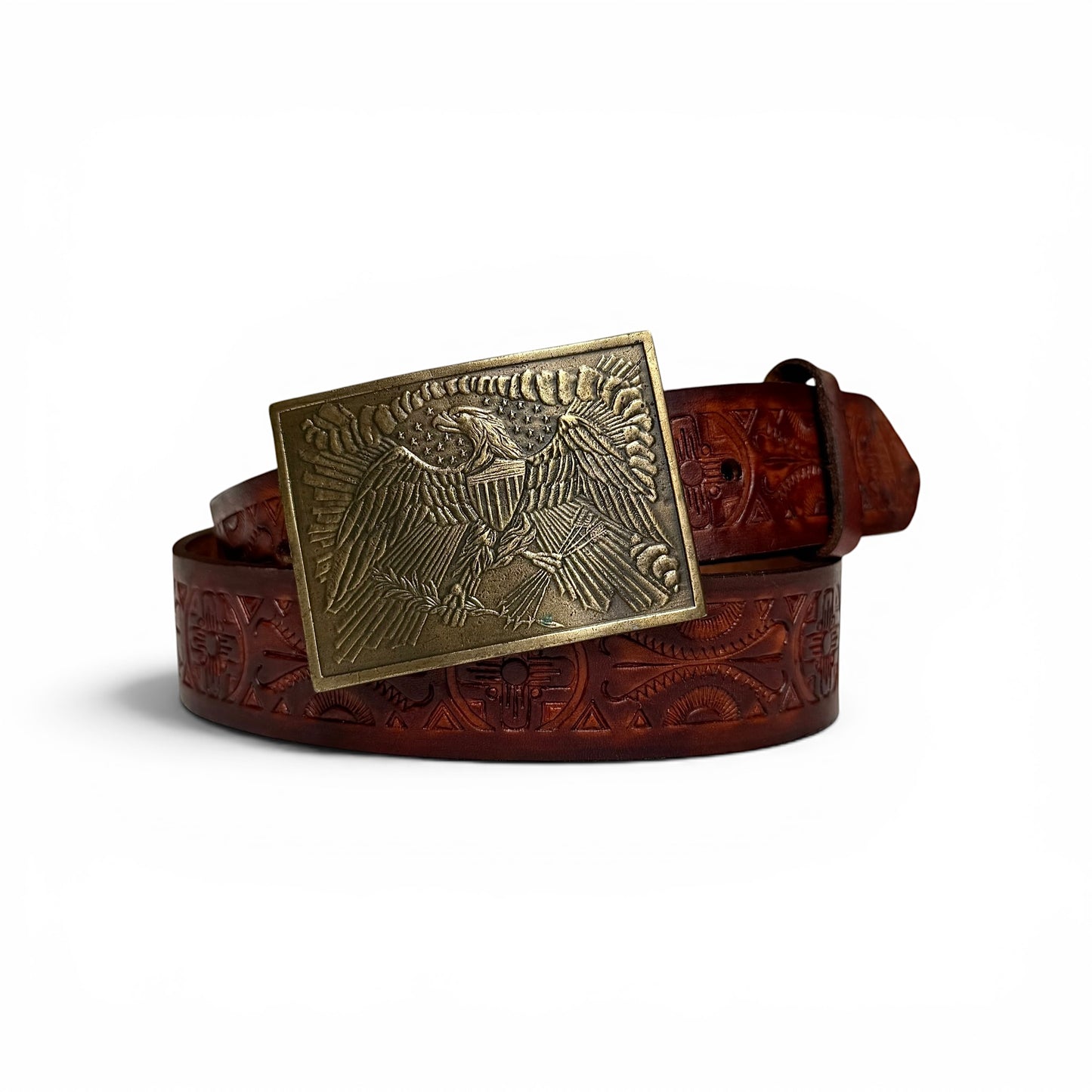 1970s Brass Eagle Buckle On Tooled Leather Brown leather belt with an eagle buckle on a white background
