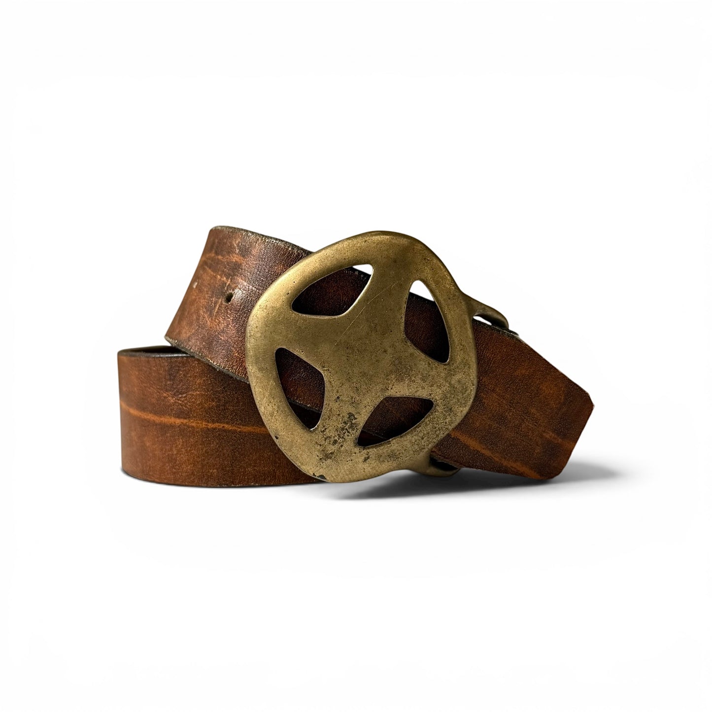 1970s David Laurie Brass Buckle Leather Belt Brown leather belt with a brutalist cross buckle on a white background