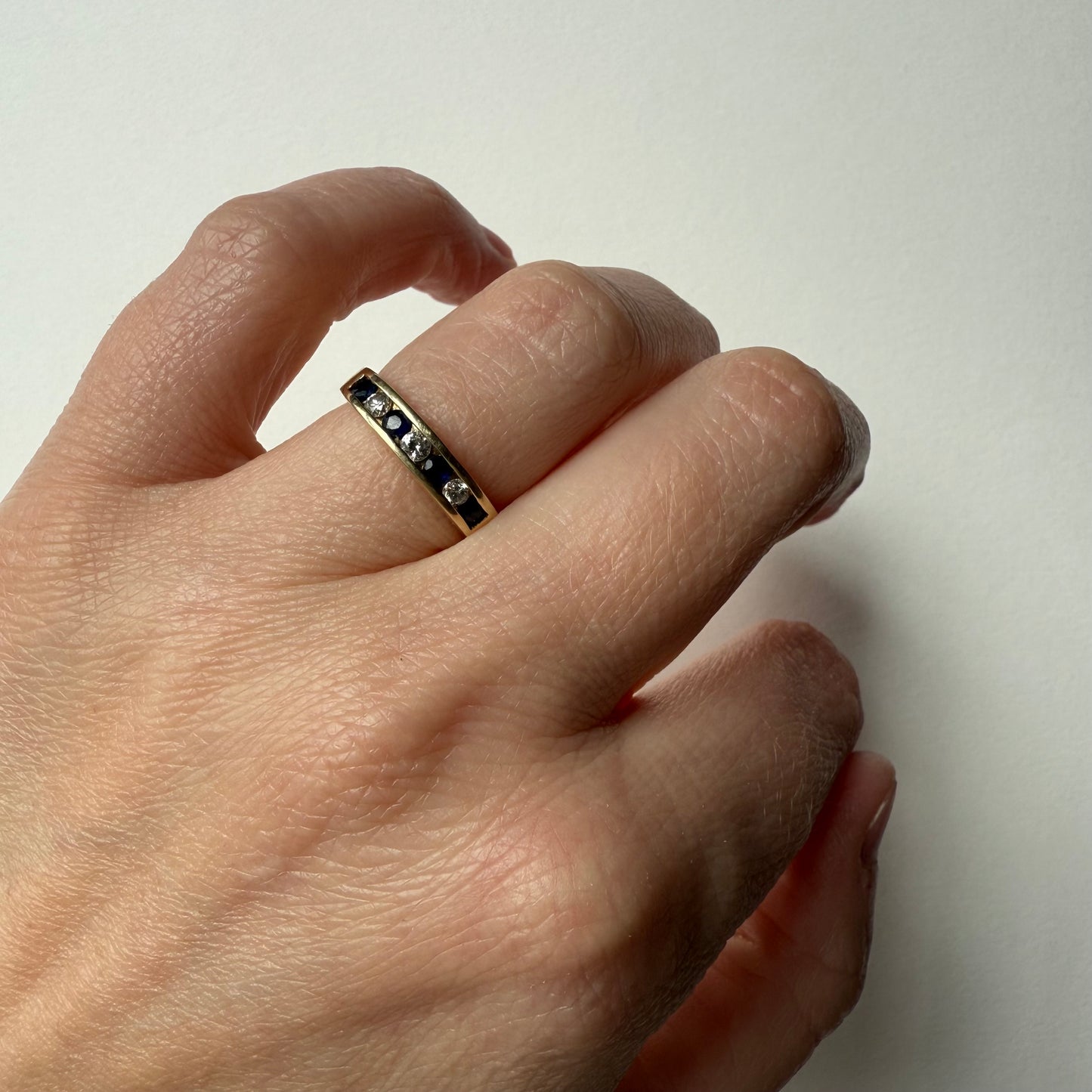 Diamond and Sapphire 14k Half Eternity Ring on hand