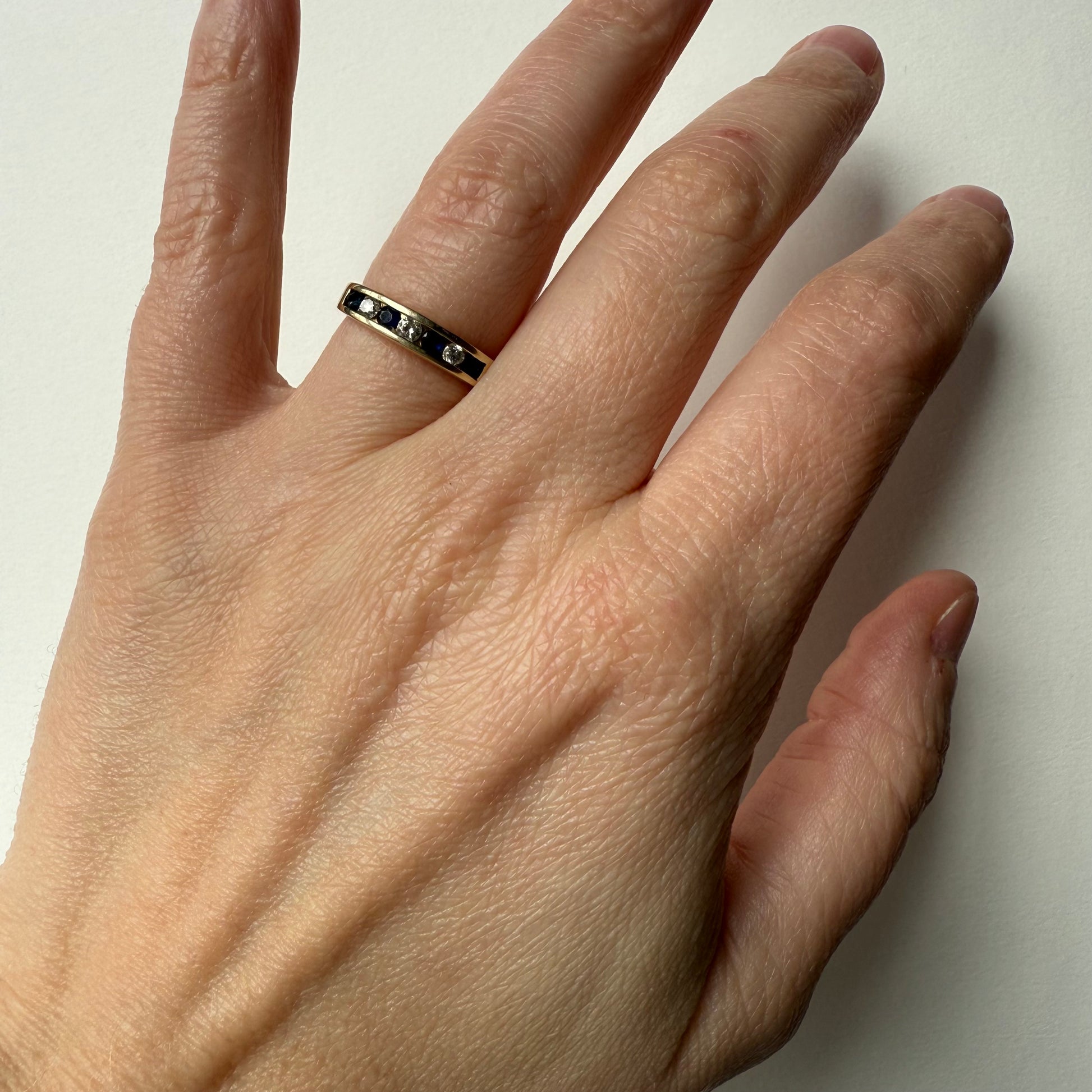 Diamond and Sapphire 14k Half Eternity Ring on hand