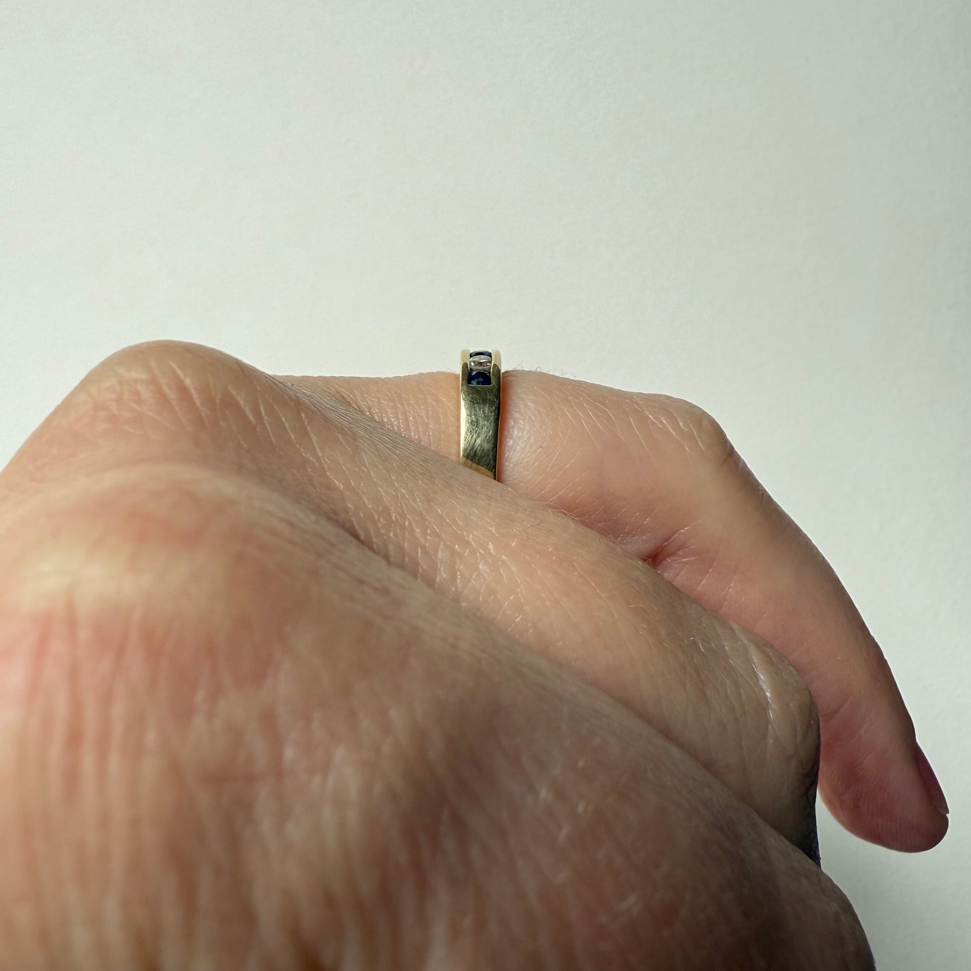 Diamond and Sapphire 14k Half Eternity Ring on hand side view