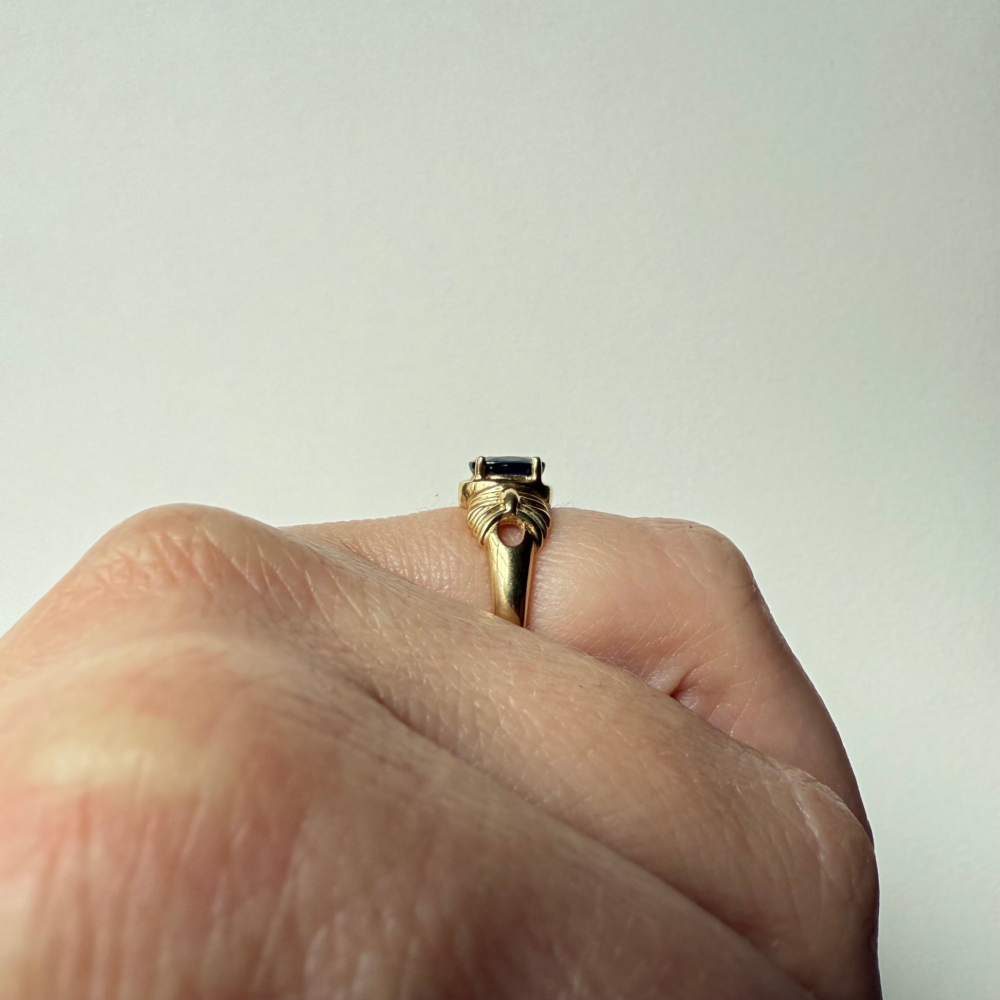 French Art Deco 14k Yellow Gold Sapphire Ring on hand side view