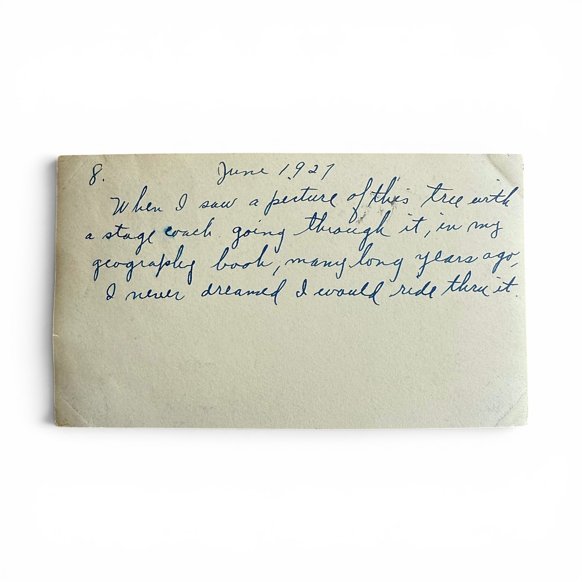 Handwritten text on the back of a photo with a white background