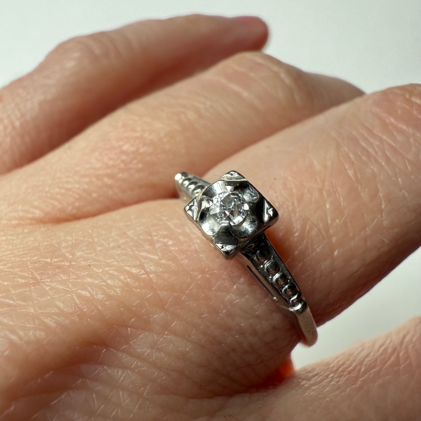 close-up of Old Mine Diamond Solitaire 14k White Gold Ring on hand
