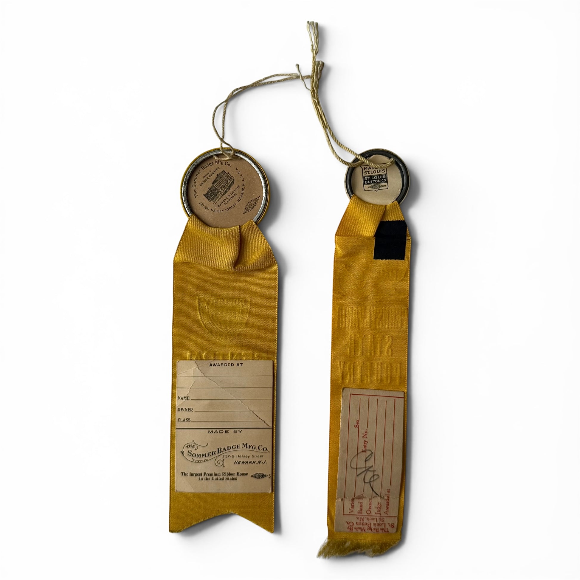 Pair of Poultry Show Award Ribbons 1912-1914 Two yellow ribbons with metal clasps on a white background