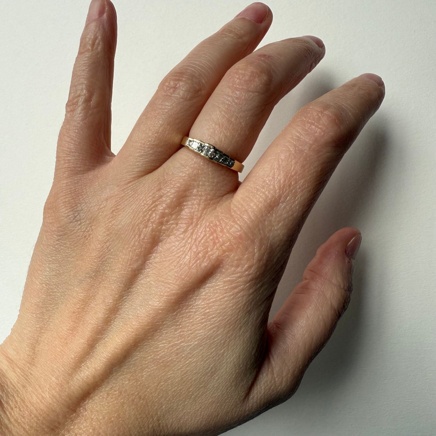 Pyramid Rise 14k Yellow Gold Princess Cut .54ctw Diamond Ring on hand