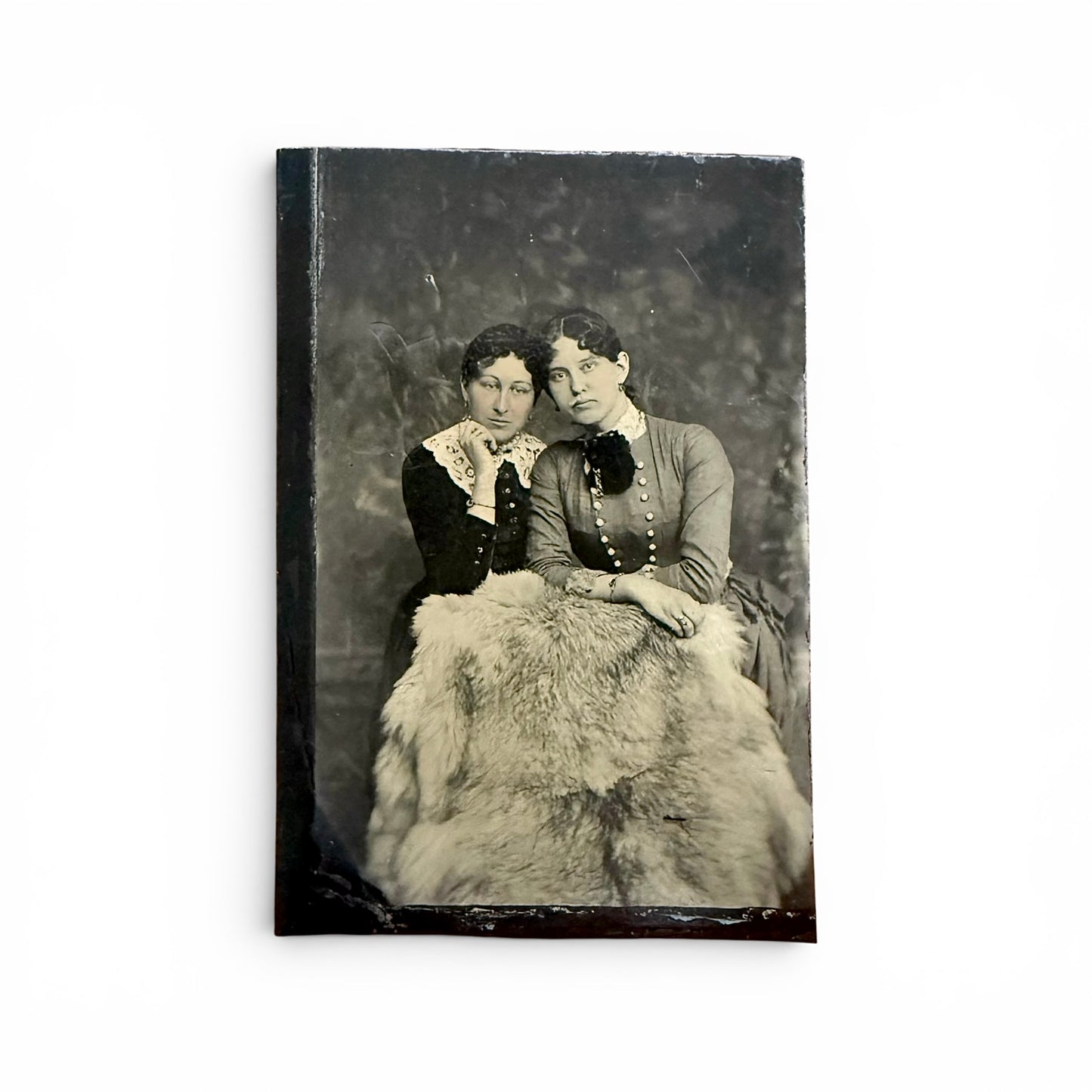 Sister Portrait - Tintype Vintage-style photo with a black and white portrait of two women.
