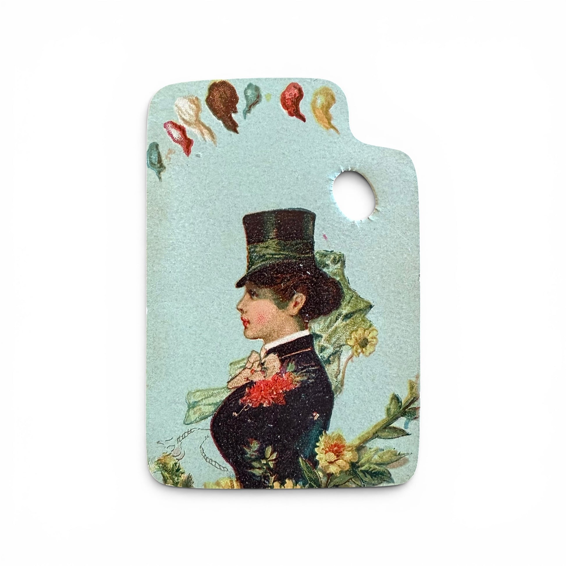 
Victorian Woman on "Paint Palette" - Trade Card Vintage decorative tag with a woman's profile and floral elements on a light blue background.
